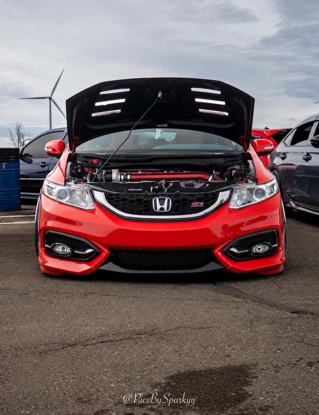Red Honda Civic Si with its hood open